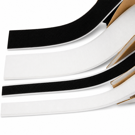 Three adhesive hook-and-loop fastener strips shown on a white background, with black loops and white backing tapes layered diagonally. A small cardboard core is visible along the right side of the strips.