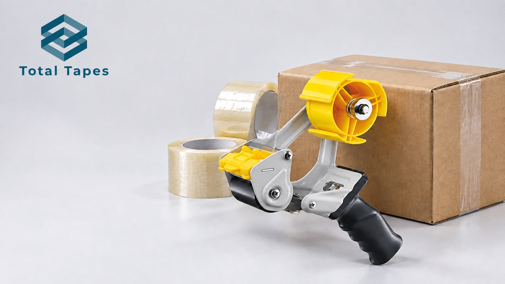 Total Tapes logo with an Excell tape dispenser, clear packing tape rolls, and a sealed shipping carton